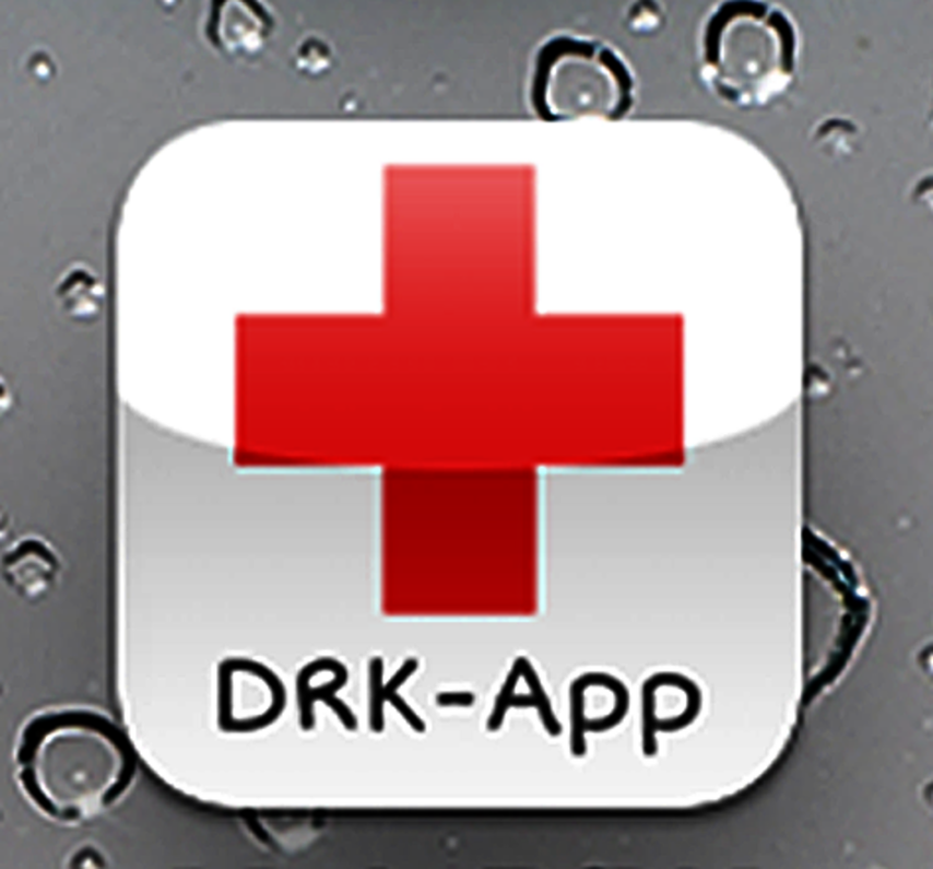 Rotes Kreuz-Symbol mit Text "DRK-App" auf grauem Hintergrund mit Wassertropfen.